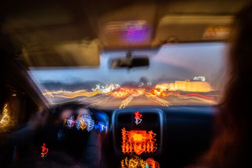 Blurred photo from inside a car at night