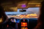 Blurred photo from inside a car at night