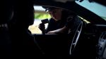 Police woman checking documents of driver - rights during traffic stop concept