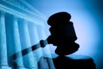 A gavel and the United States Supreme Court building - post conviction relief concept